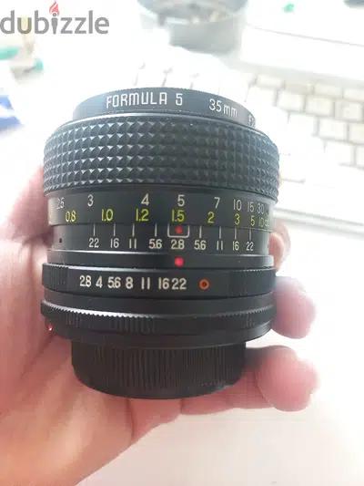 2 Nikon SLR  Lenses - 2 Panasonic i think G40 Lenses