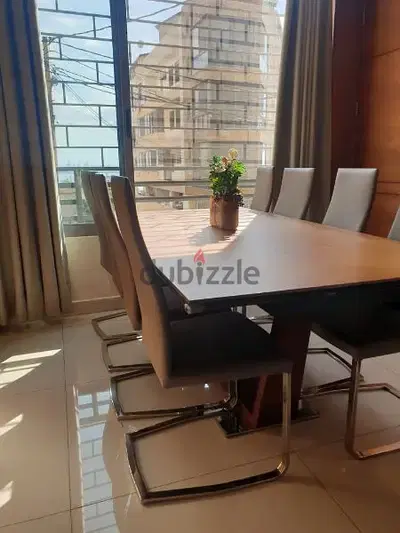 Dinning table with 8 leather chairs