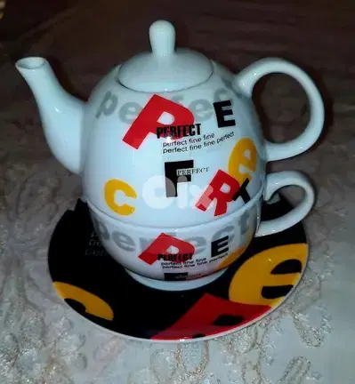 original tea cup with tea pot