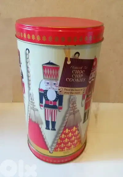 Christmas deco. Rotating musical tin biscuit box nutcracker 22cm