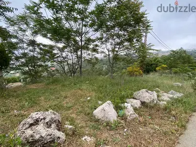 A 1015 m2 land with prime location for sale in Klayaat - القليعات
