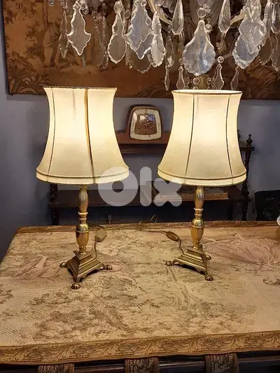 pair of bronze and leather lamps
