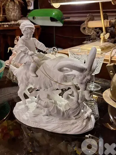 antique biscuit statue
