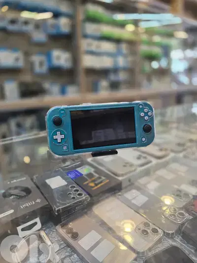 Used  nintedno switch lite  turquoise 100$