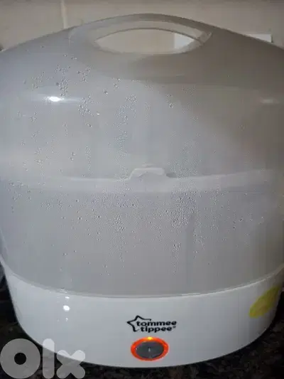 Tommee Tippee Sterilizer + free baby clothes