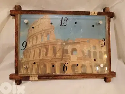 ساعة حائط عالبطارية خشب وزجاج