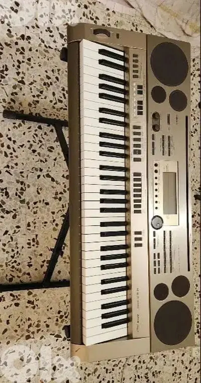 casio keyboard at3 تضيف مع ستاند و كرتونتو موجودة