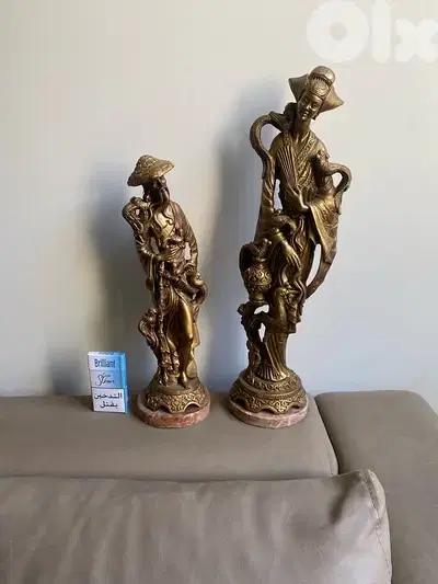 Two resin old statues . 51 cm. 41 cm.