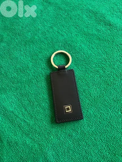 Original S. T. Dupont genuine leather keychain.
