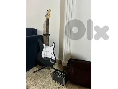 electric guitar + amplifier