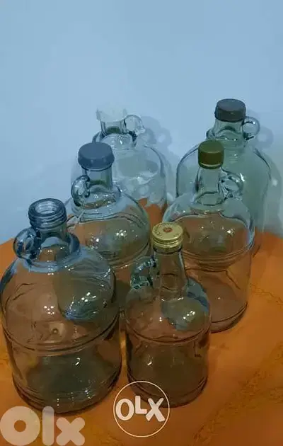 Glass galons. sizes:small 24cm,medium 27cm,L 31cm,XL 33cm غالون زجاج