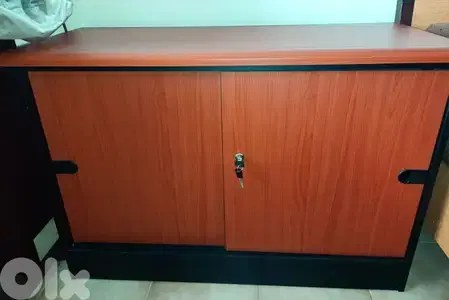 Closet for office with one shelf and sliding doors